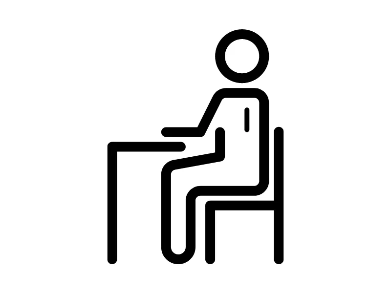 Black and white figure of student at desk