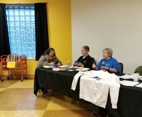 Friends volunteers conducting a past Annual Meeting.