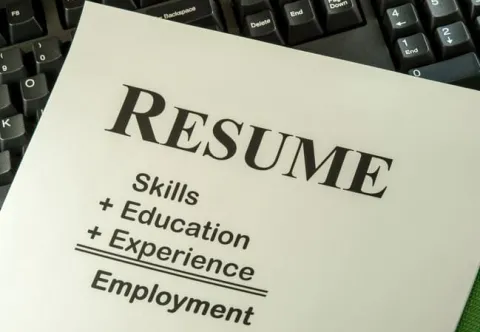 photo of words Resume at top with skills + education + Experience above the word Employment