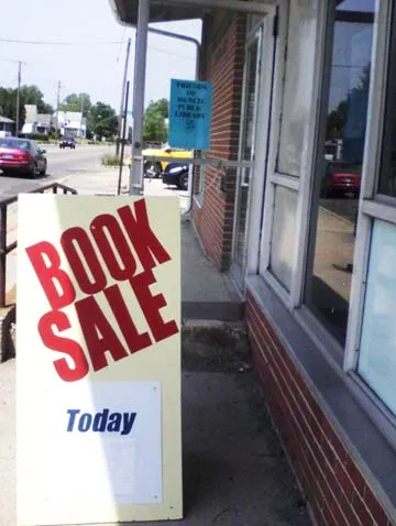 Book Sale sign shown outside the Friends Building at 1110 W. Memorial Drive, Muncie, IN. 