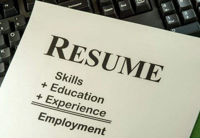 photo of words Resume at top with skills + education + Experience above the word Employment