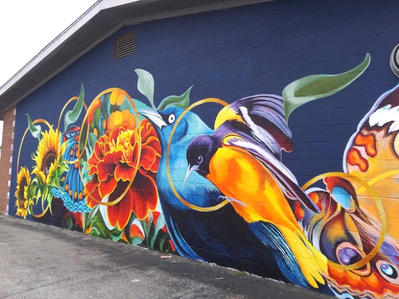 Photo of the vibrant "Five Dots" mural on the Friends Building.